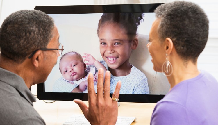 Grandparents videochatting with granddaughters